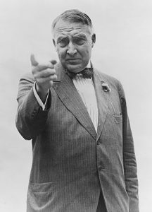 Harding, walking into a Baltimore speakeasy in 1921, selecting his intended companion for the night from amongst the crowd with the question "Who wants to sex the President?" (Not really.)