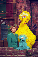 Photograph of First Lady Hillary Rodham Clinton Posing on the Big Bird Nest Set with Big Bird... by The U.S. National Archives sesame street photo