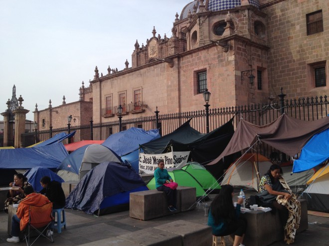 Normalista camp in front of cathedral.