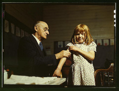 Dr. Schreiber of San Augustine giving a typhoid innoculation at a rural school, San Augustine County, Texas (LOC) by The Library of Congress physician pregnant photo