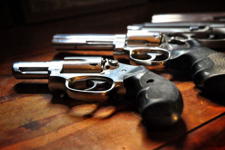 Three guns lined up in a row.