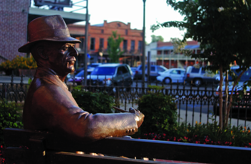 Statue of William Falkner on a park bench